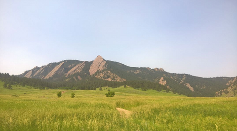 view of boulder colorado mountains photo by luc ried