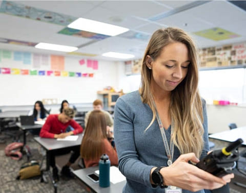 Education Female Primary School Teacher with Motorola Two-Way Radio Professional Walkie Talkie 