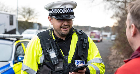 Public Safety UK Police Officer with Motorola Two-Way Radio Professional Walkie Talkie