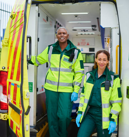 Two female ambulance crew equipped with two way radios supplied by CTS Radios Hire Service.