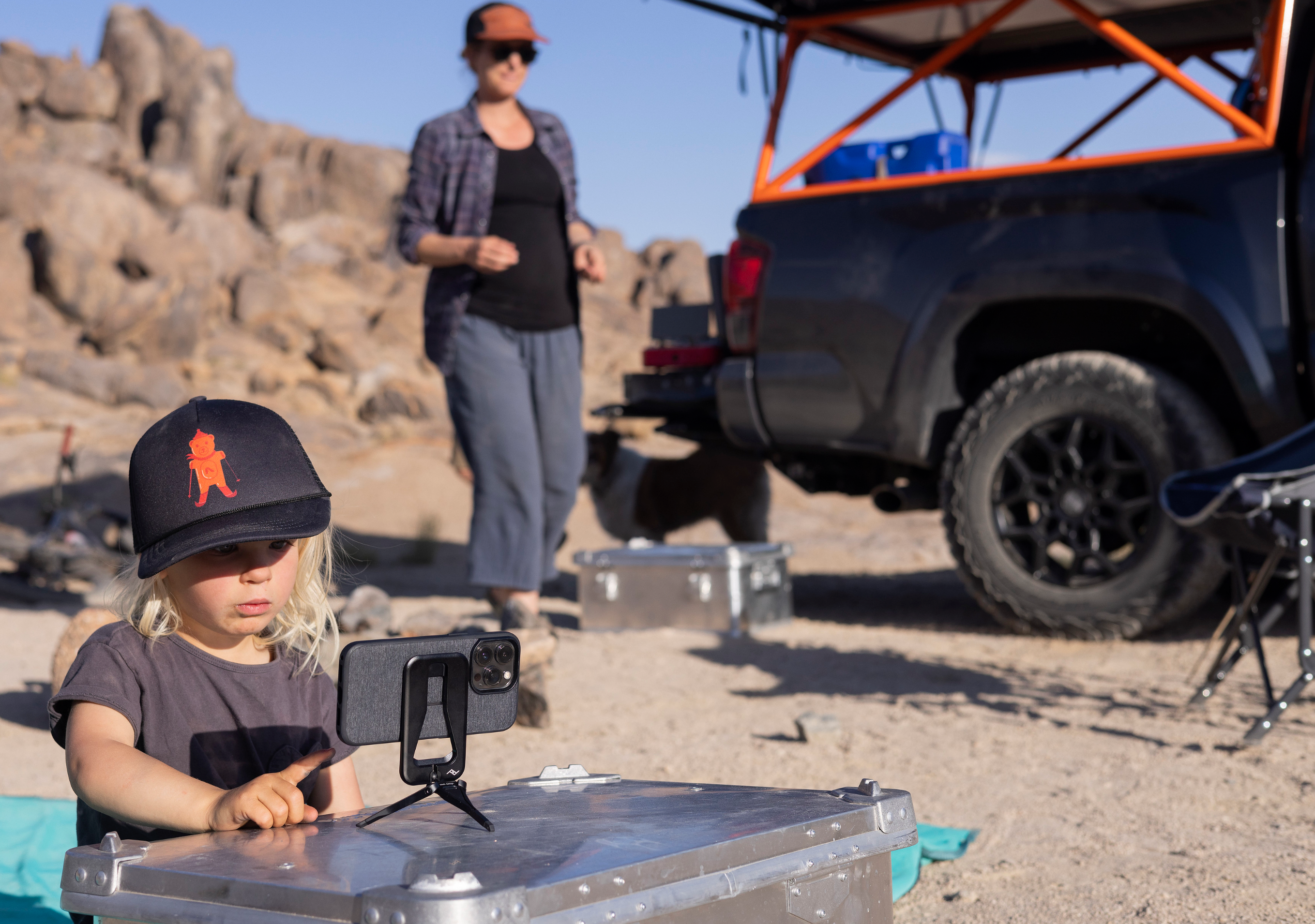 A photo of a woman and her son road tripping using the Peak Design's Mobile Tripot to capture the photo of the nature