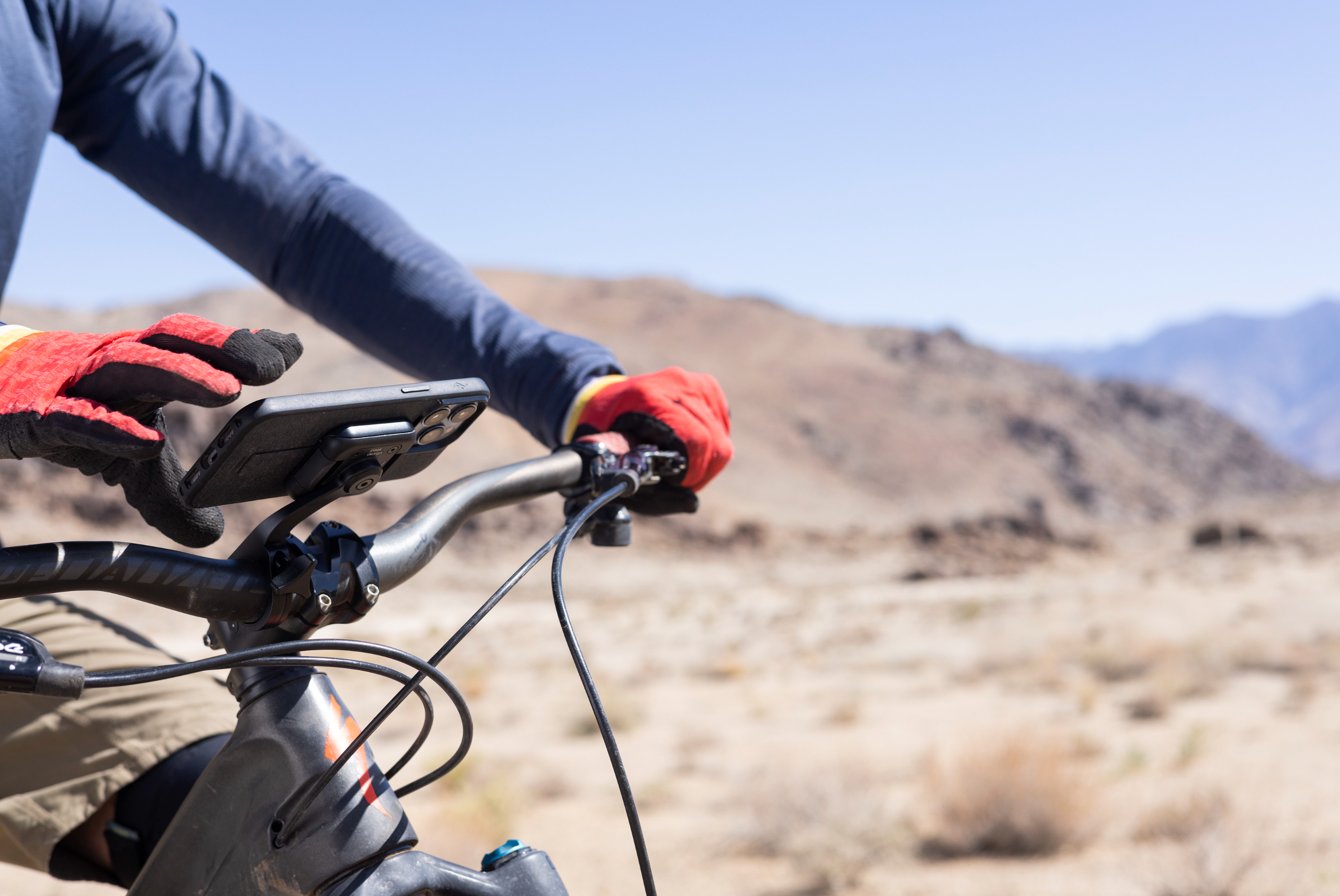 A photo of the bike in a dessert with a Bike Mount on it