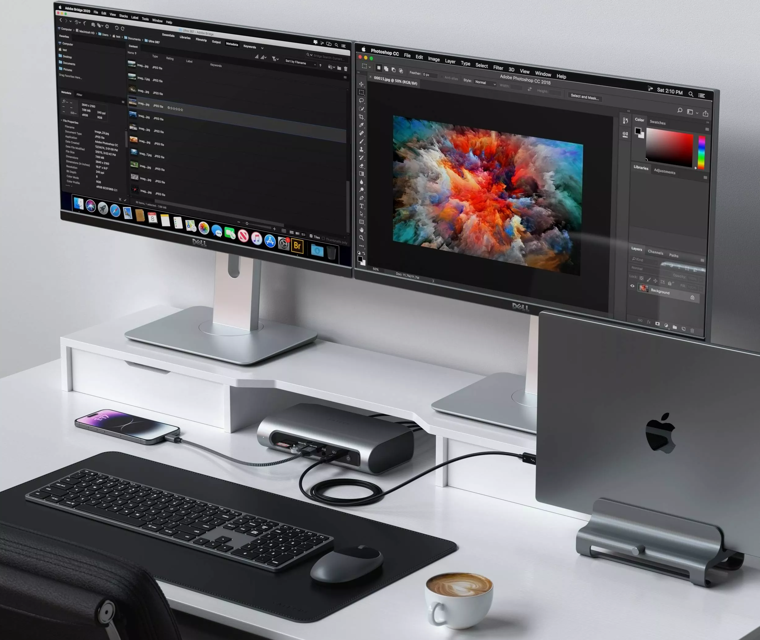 Two Mac computers on the table with the rest tech gadgets and Satechi's Multimedia Dock