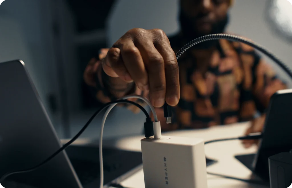 Man charging his tech products using Hyper devices