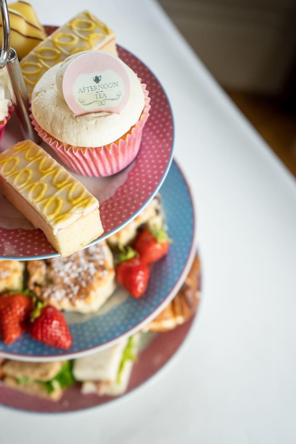 Afternoon tea with branded cupcakes using printed edible toppers