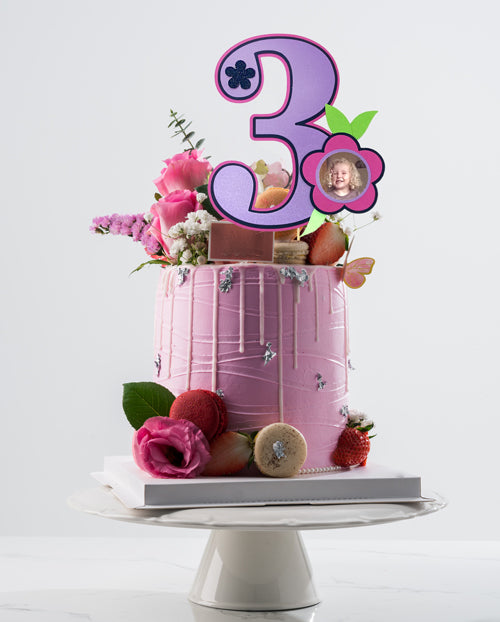 Number of beautiful cakes with colorful flower decorations on a glass  surface Stock Photo - Alamy