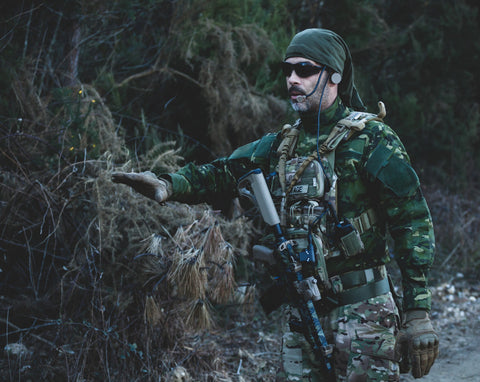 image of a man holding a gel blaster with upgrades