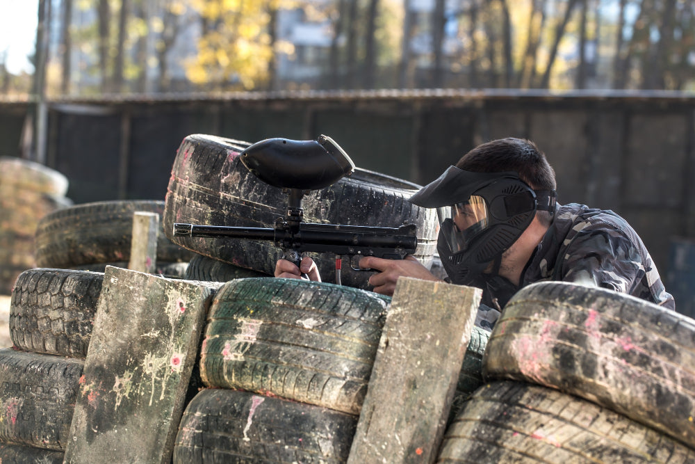 image of a man holding a paintball gun