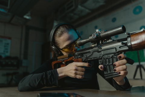 girl aiming a gel blaster sniper