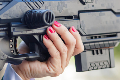 Image of a hand grabing a gun