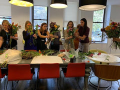 people arranging bouquets