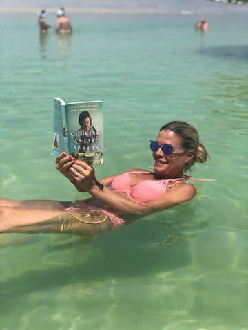 Cat Reading On The Beach