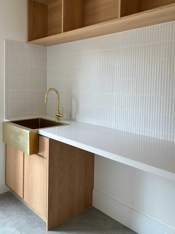 Custom Laundry Cabinetry with American Oak, Caesarstone and Brass