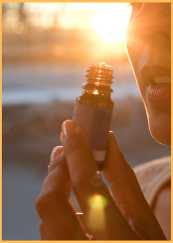 essential oil bottle and sun