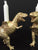 The Vanilla Studio Candlesticks Dinosaur Shabbat Candlesticks in Gold