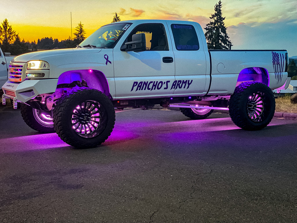 white lifted truck with pink