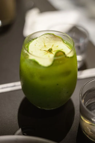 A glass of cold green juice