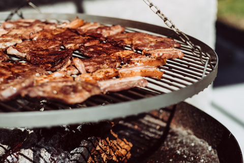 A barbecue grilling fatty meat