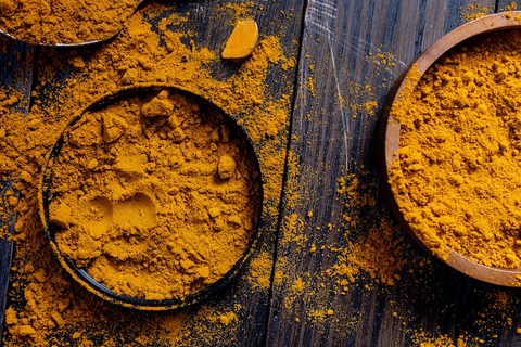 Three bowls of turmeric powder