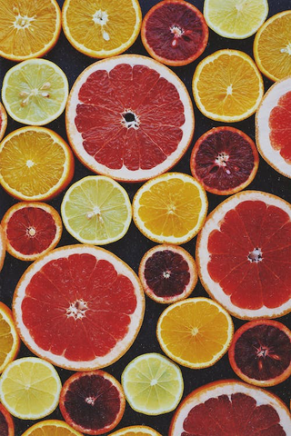 Sliced grapefruit, oranges, blood oranges, and limes
