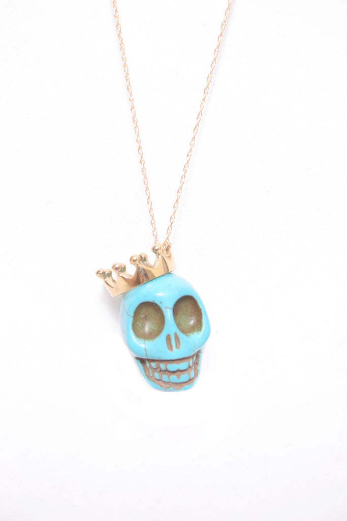 blue skull necklace with gold crown