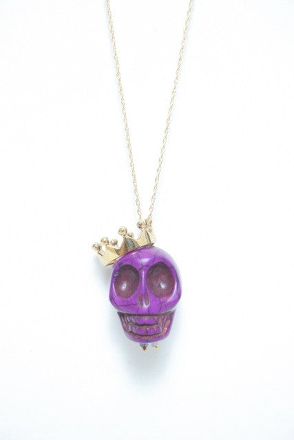 blue skull necklace with gold crown