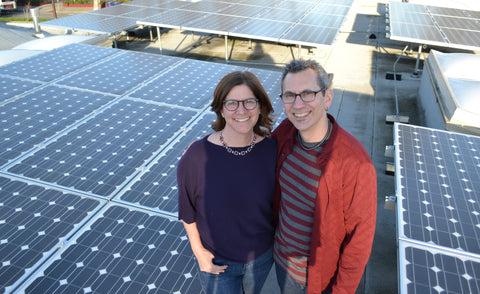 Christa and Lawrence with rooftop solar array