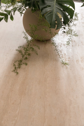 Travertine dining table from The Loom Collection furniture store in Dubai. 