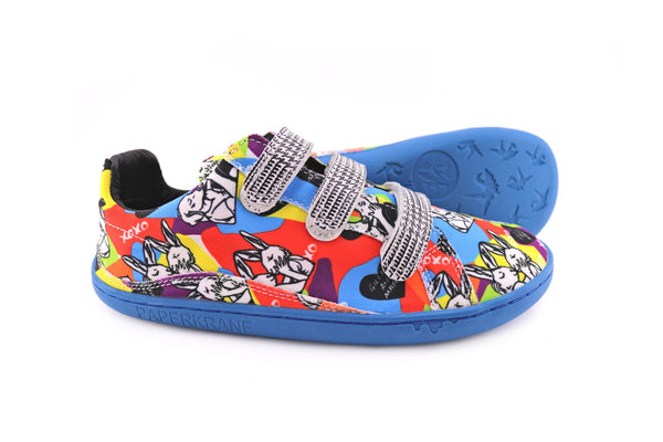 A pair of G&M LOVE shoes, with colourful print, kissing dogs and rabbits, and a blue sole.
