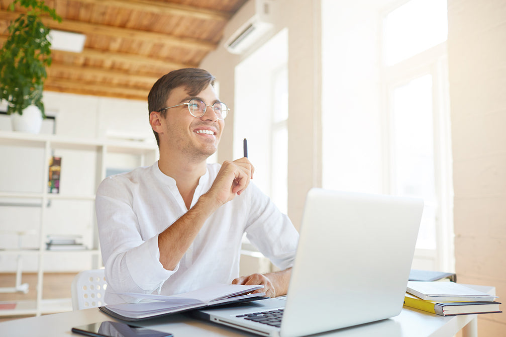 happy-pensive-young-businessman