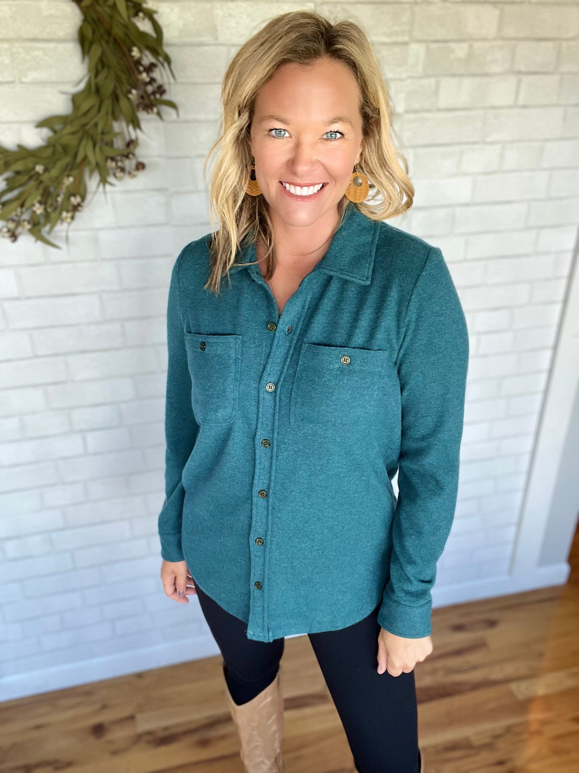 Comfy shirt jacket in a flecked blue-green color. Fit is true to size.