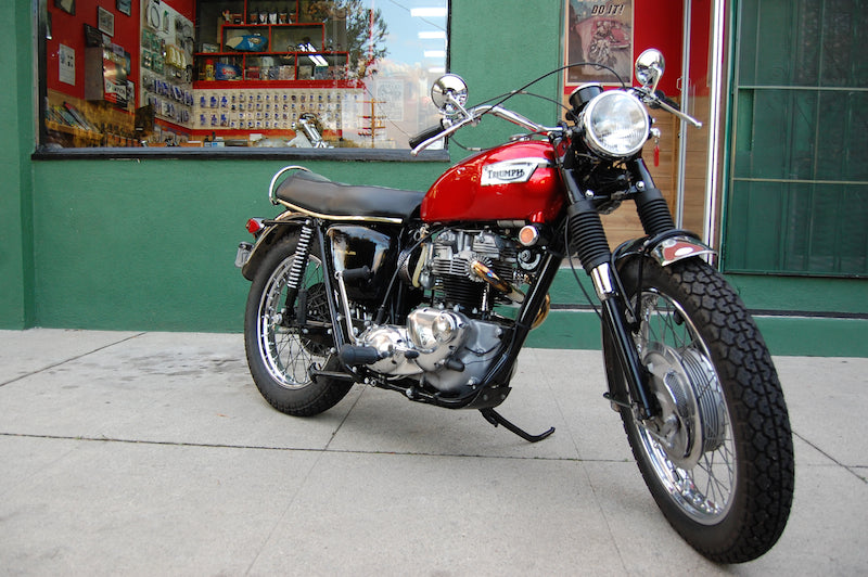 Triumph TR6C on sidewalk