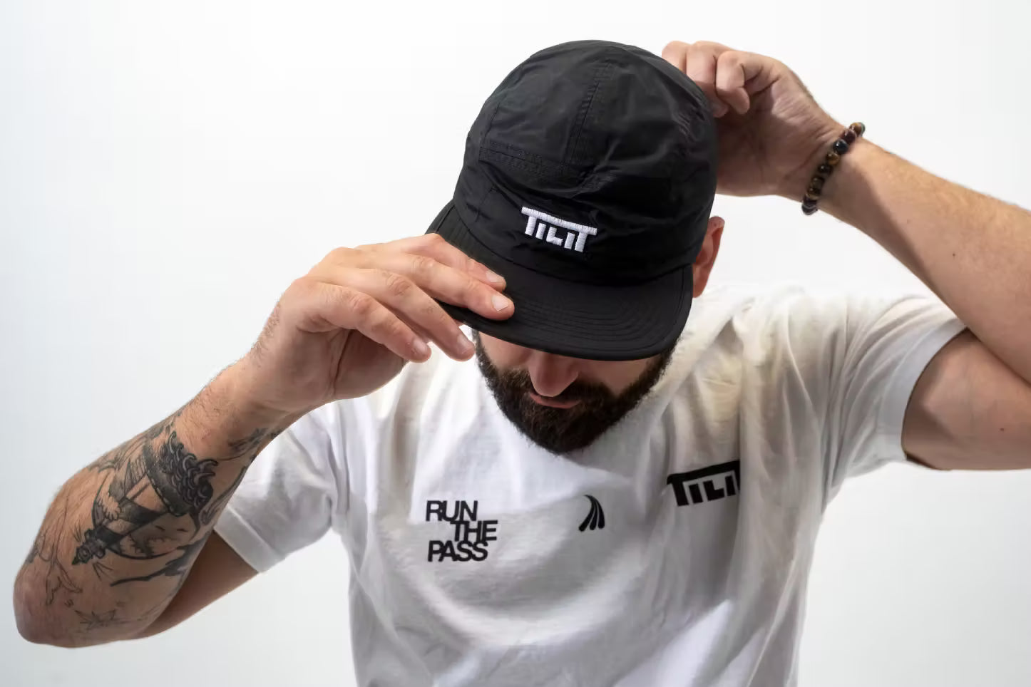Run the Pass” Black 5 Panel Performance Cap - TILIT