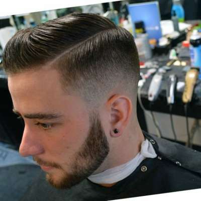 fade haircut with side part