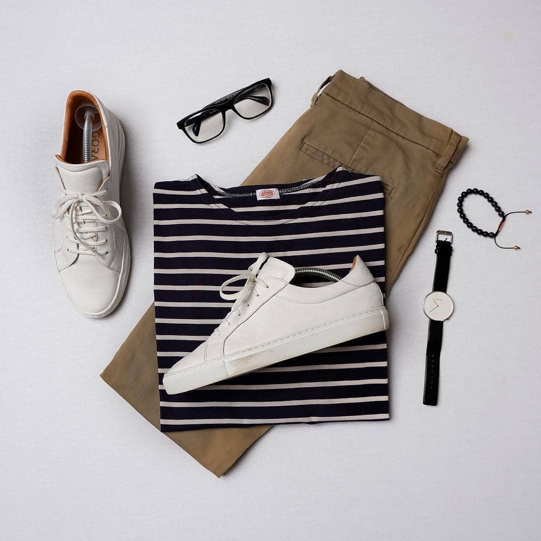 Brown chinos, black and white striped t-shirt and white sneakers