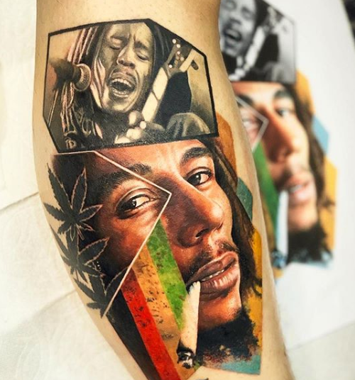 Black and grey Bob Marley tattoo on the forearm