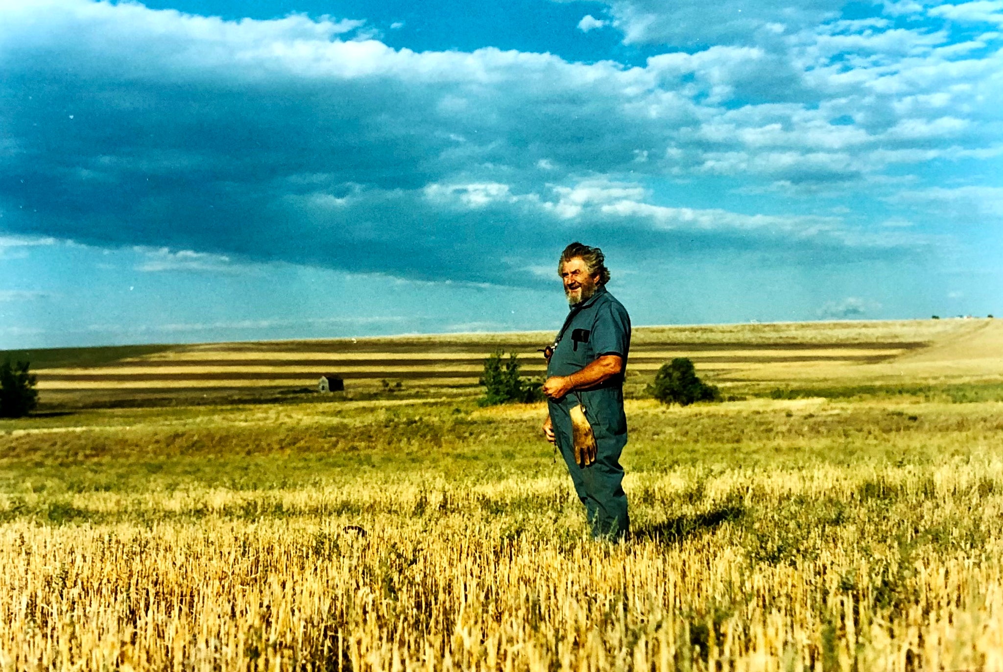 Erney standing in a field on the prairie