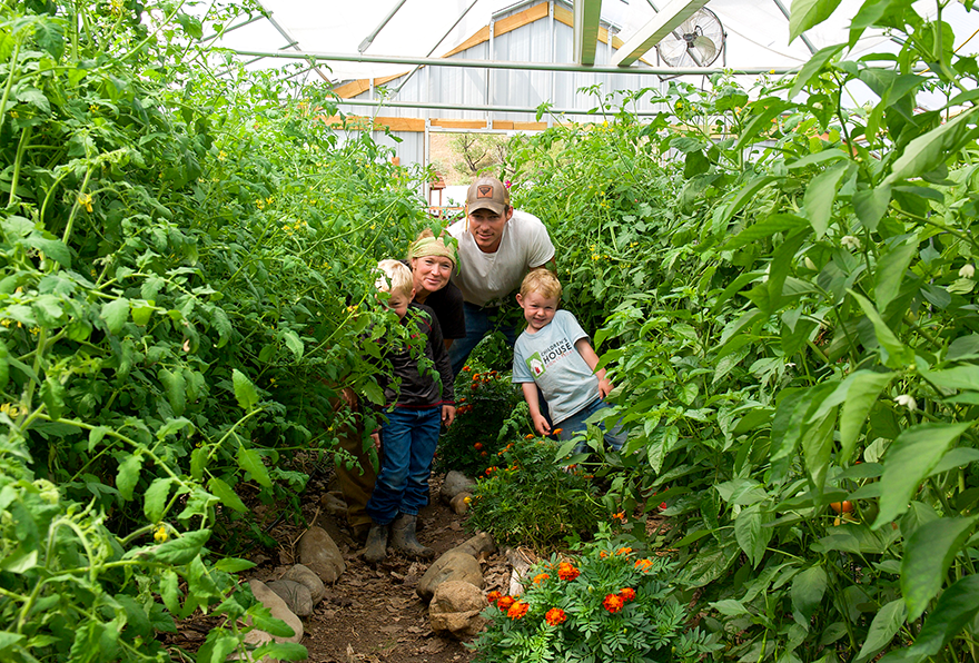 Jones family in their greenhouse garden