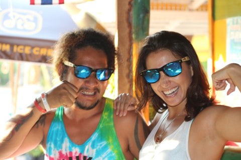 guy and girl wearing matching sunglasses in the shade of blue