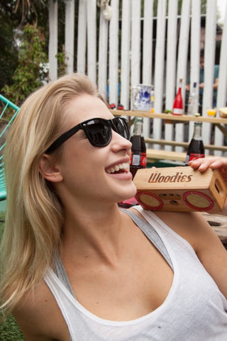 blonde girl in white tank top smiling