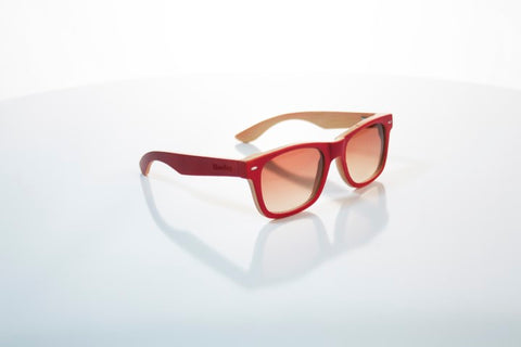 red wooden sunglasses with the brand woodies in the shade of brown