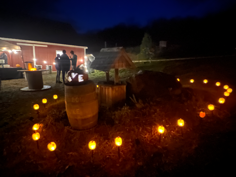 Small pumpkin lights surrounding the tent entrance to Wood's Vermont Maple Sugar House at our Annual Pumpkin Walk.