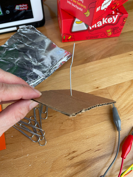 paperclip base for joystick pushed through cardboard