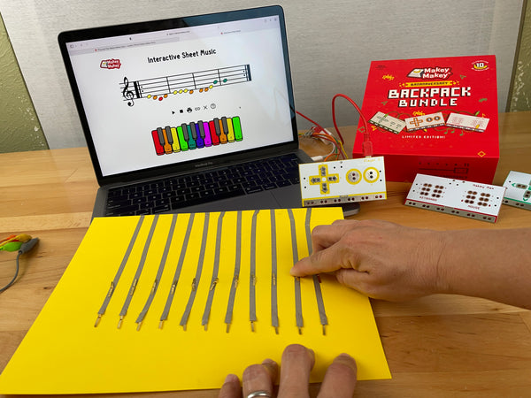 Place fastener legs down on conductive tape