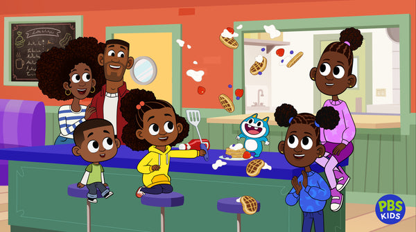 Series image for Lyla in the loop. A family is in a diner, the kids are on diner stools and Lyla is holding a spatula. There are waffles and whip cream in the air! The parents are standing behind the counter smiling and looking on.