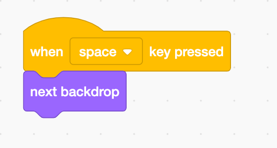 Image of Scratch blocks "When key pressed" and "next backdrop"