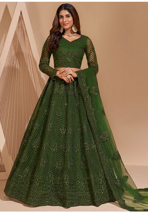 Photo of Bride twirling in dark green lehenga with groom | Couple wedding  dress, Dark green lehenga, Wedding outfit