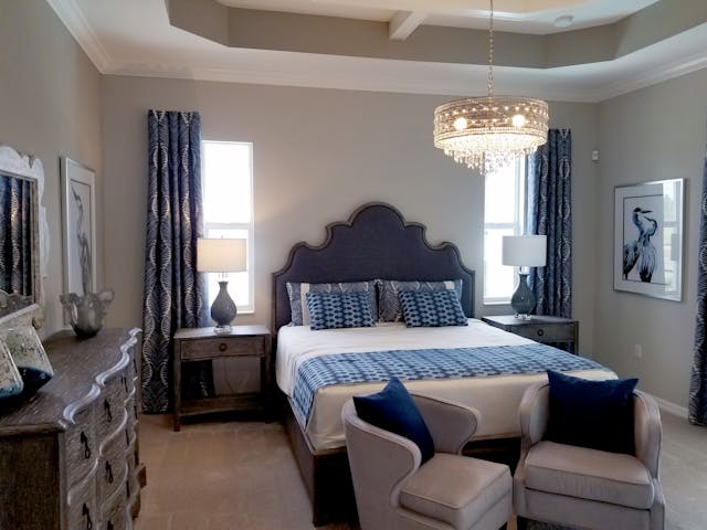 Luxuriate in the subtle elegance of a tastefully staged bedroom.