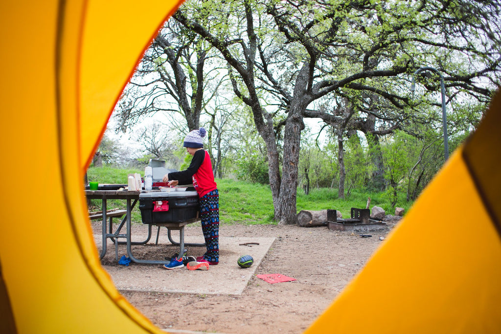 Boy making food while camping | Quiet Time Photo Challenge