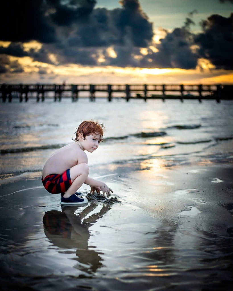 Night photo of a Boy playing at the beach